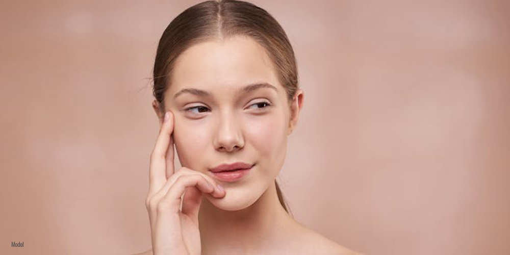 a woman thinking about the best skin care practices when moving to a humid climate